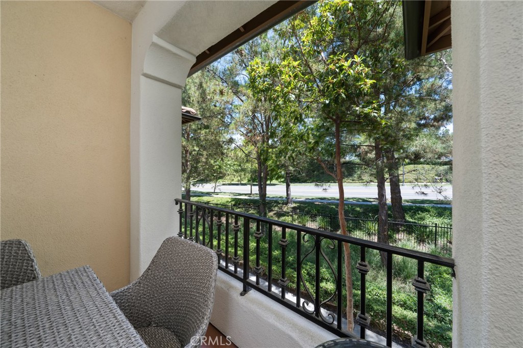 322 Dewdrop Irvine, CA 92603 - Photo 20 of 26 a balcony with wooden floor and outdoor space