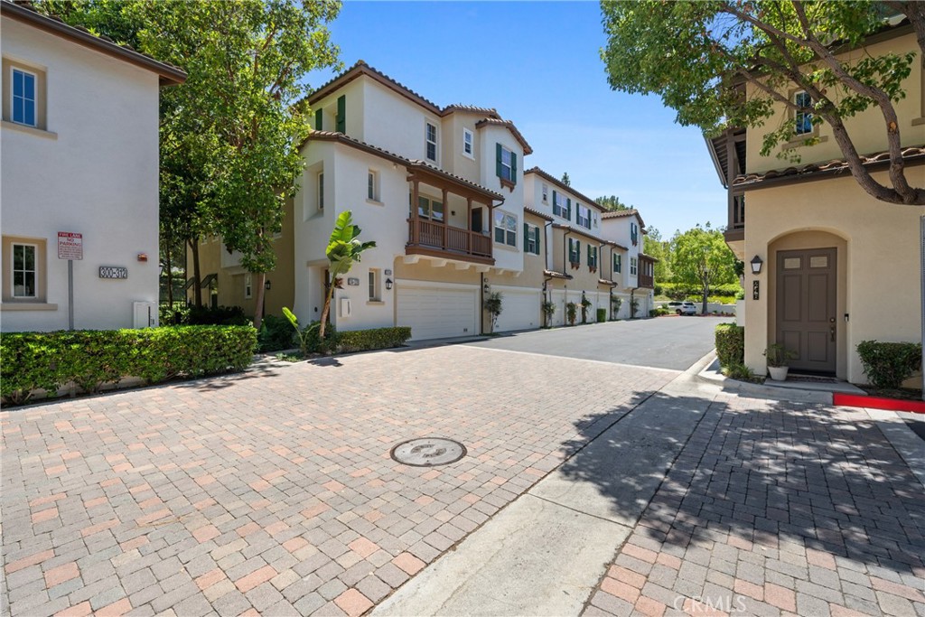322 Dewdrop Irvine, CA 92603 - Photo 23 of 26 a view of a building with a yard