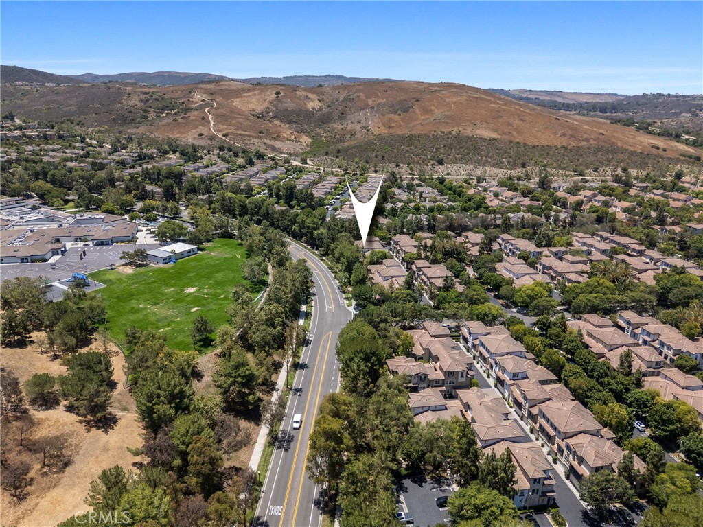 322 Dewdrop Irvine, CA 92603 - Photo 24 of 26 an aerial view of residential houses with outdoor space and trees