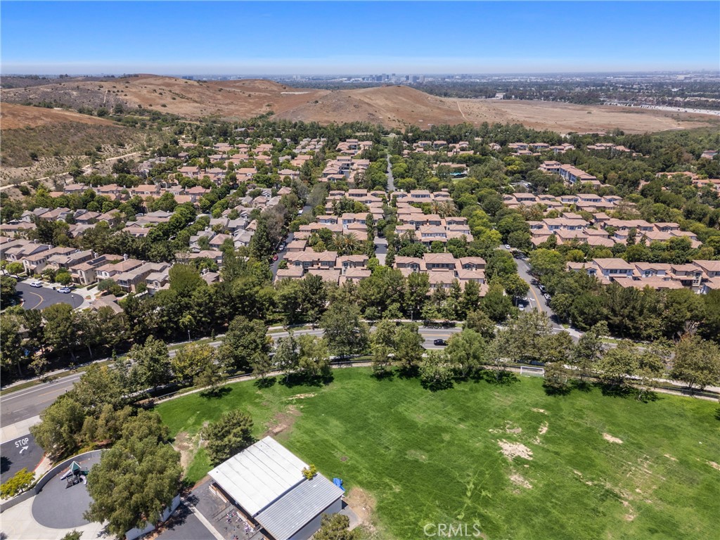 322 Dewdrop Irvine, CA 92603 - Photo 26 of 26 an aerial view of residential houses with outdoor space and trees