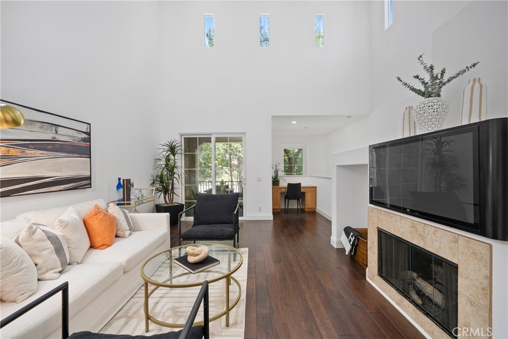 322 Dewdrop Irvine, CA 92603 - Photo 4 of 26 a living room with furniture and a flat screen tv