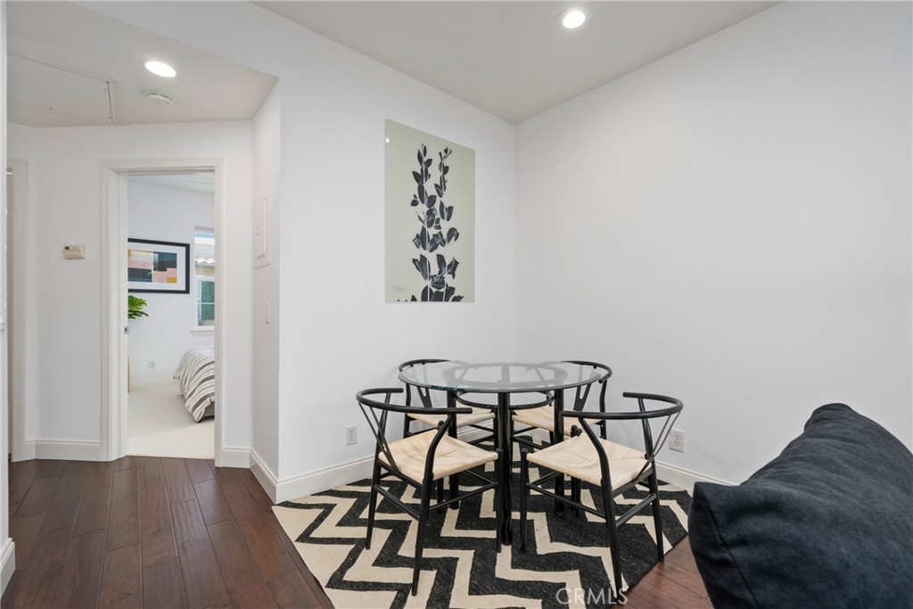 322 Dewdrop Irvine, CA 92603 - Photo 5 of 26 a view of a dining room with furniture and wooden floor
