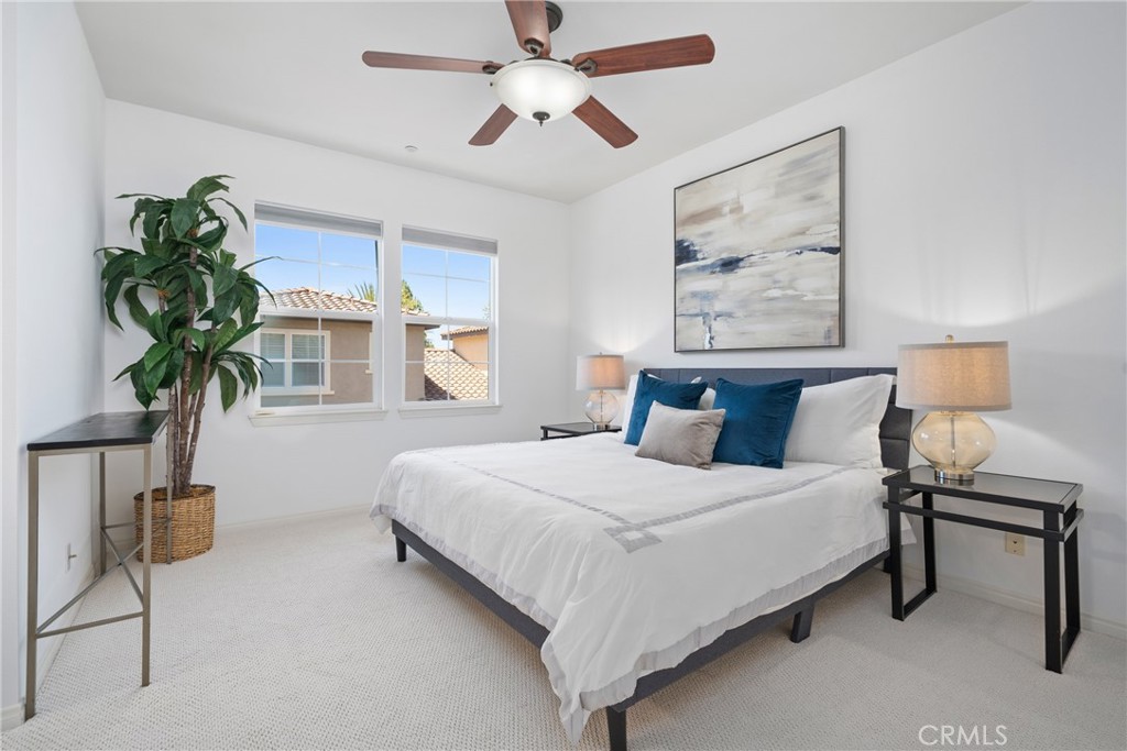 322 Dewdrop Irvine, CA 92603 - Photo 9 of 26 a bedroom with a bed and a chandelier