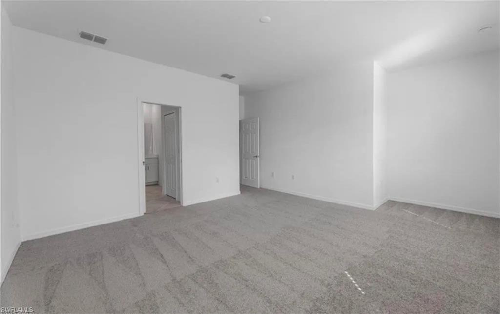 15481 Wildflower Circle Naples, FL 34119 - Photo 5 of 7 a view of an empty room