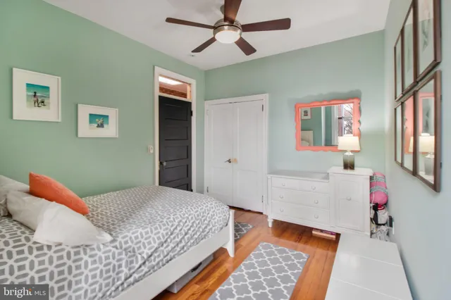 a bedroom with a bed and a dresser