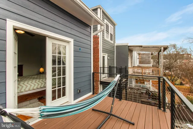 a view of a balcony with chairs