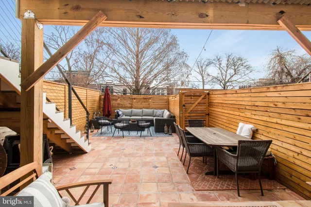 a view of outdoor sitting area with furniture