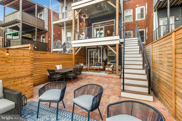 a view of a chairs and a tables in the balcony