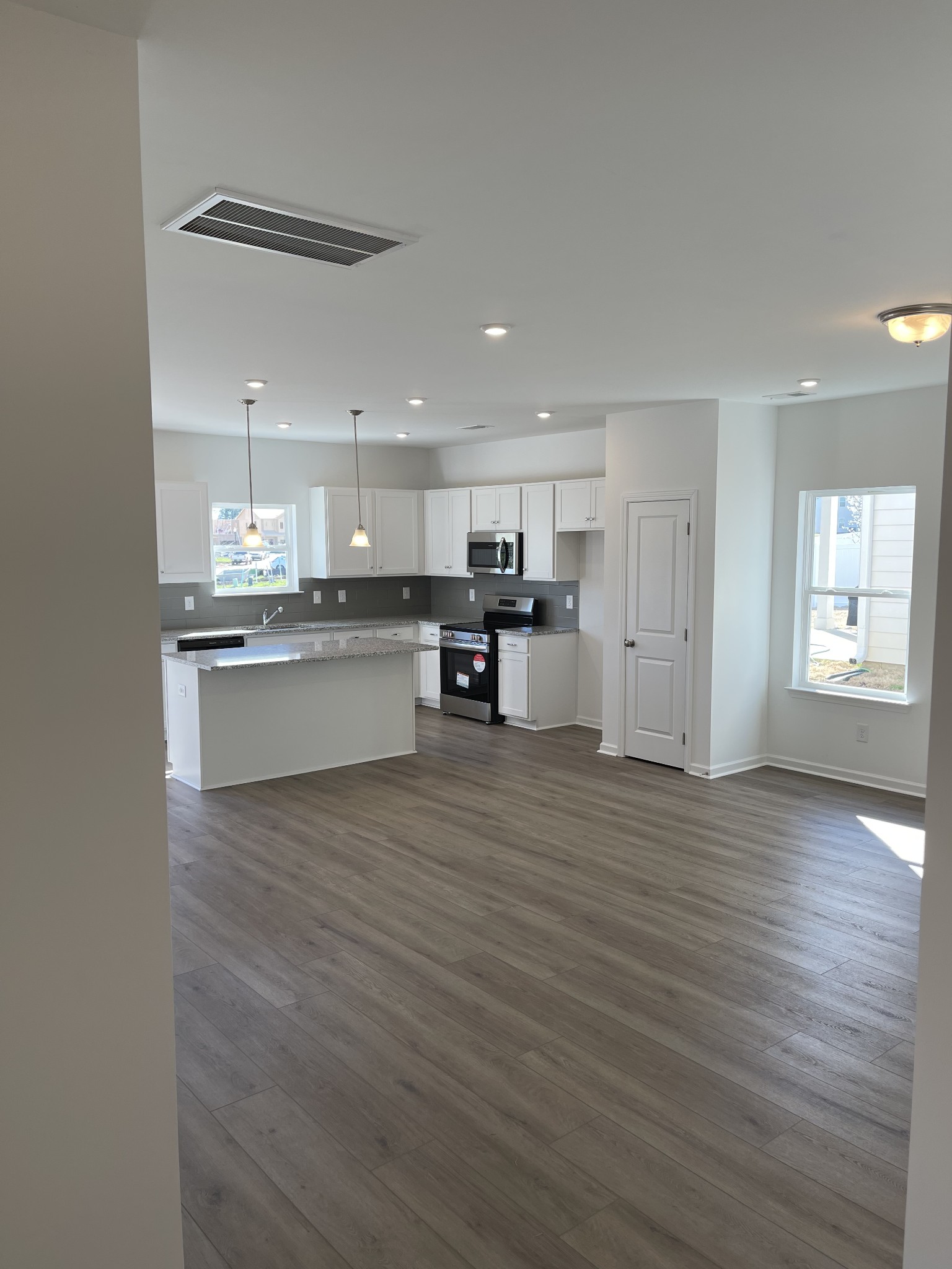 356 Winston Way Gallatin, TN 37066 - Photo 13 of 28 a view of kitchen with granite countertop cabinets and wooden floor