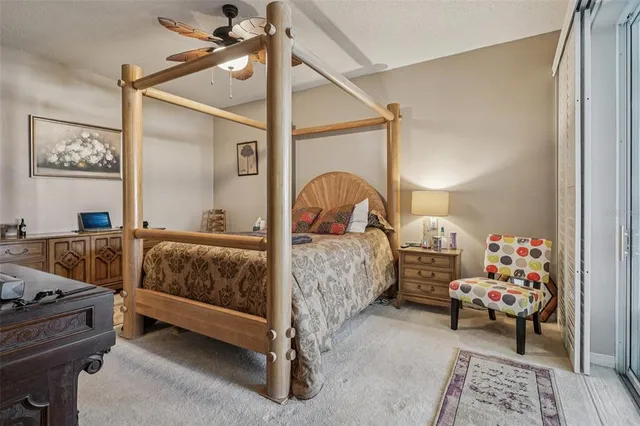 a bedroom with bed and a window