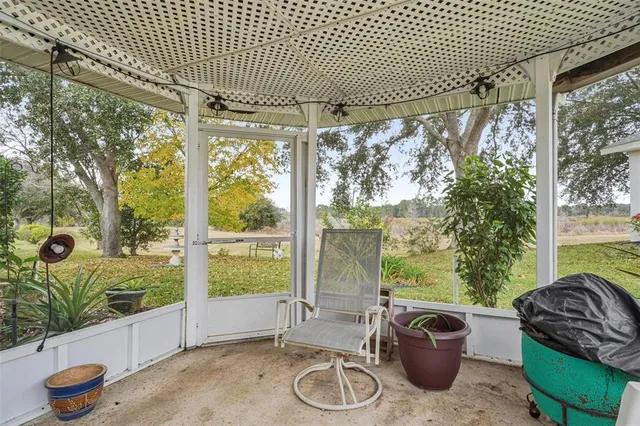 a room with furniture and a large window