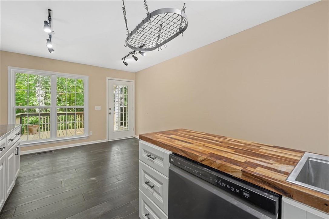 210 Briarcliff Road Central, SC 29630 - Photo 12 of 39 This bright kitchen features a durable butcher block countertop and offers direct access to the outdoors.