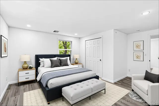 a bedroom with a bed and a couch