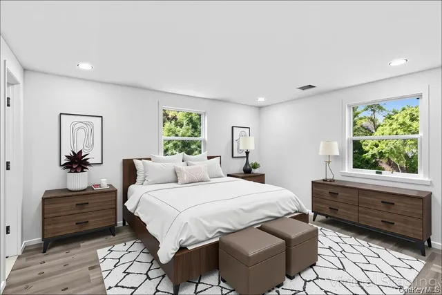 a bedroom with double bed and a window