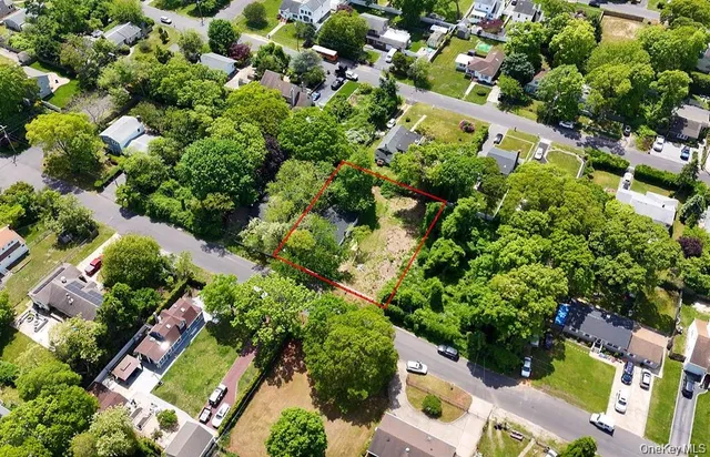 an aerial view of a house with a yard and outdoor space