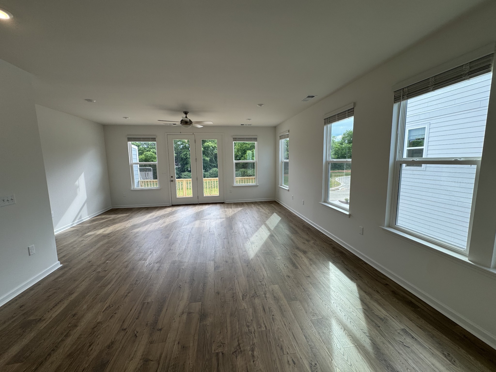 410 Blair Road Smyrna, TN 37167 - Photo 11 of 27 a view of an empty room with wooden floor and a window
