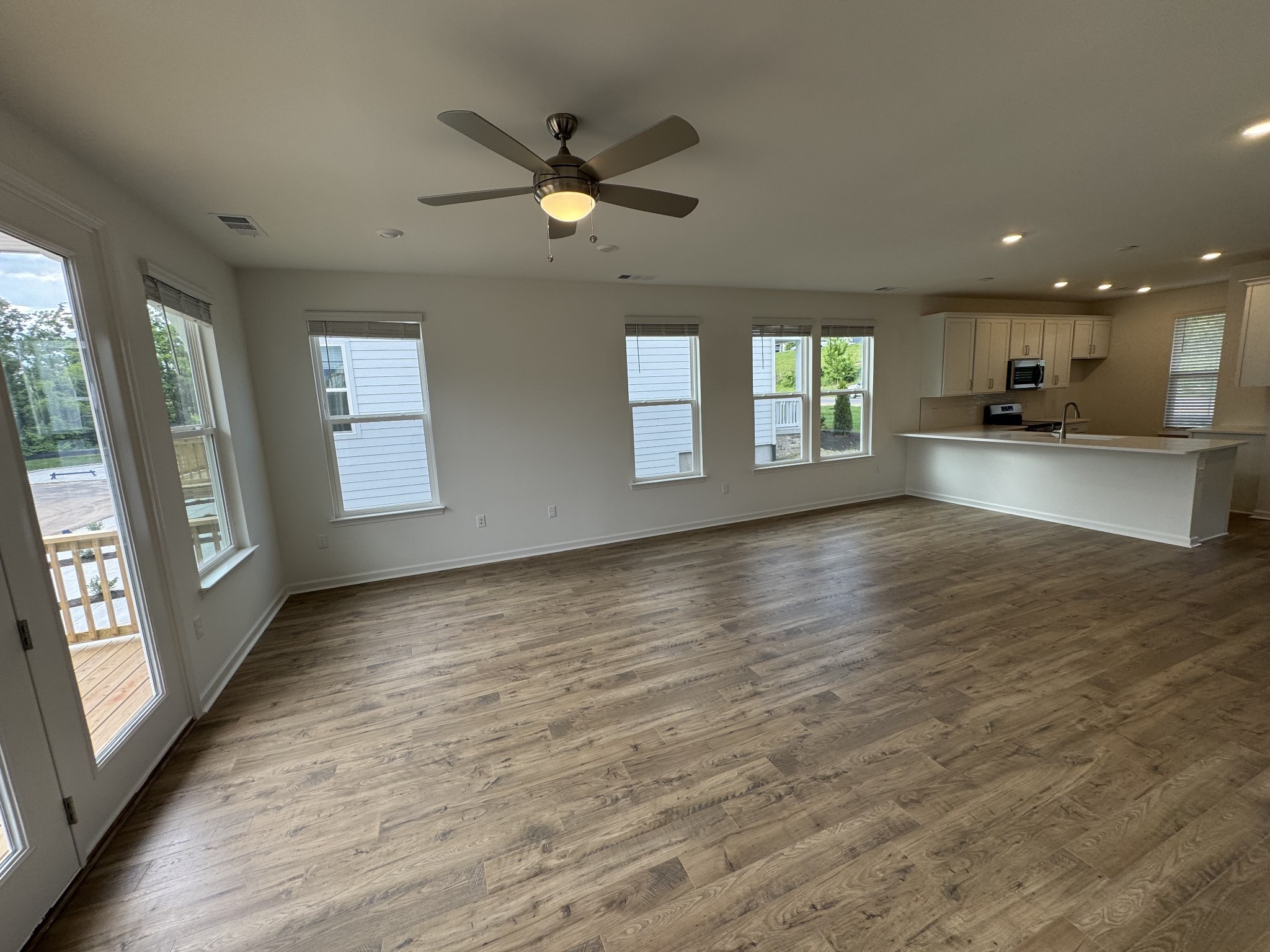 410 Blair Road Smyrna, TN 37167 - Photo 12 of 27 an empty room with wooden floor and windows