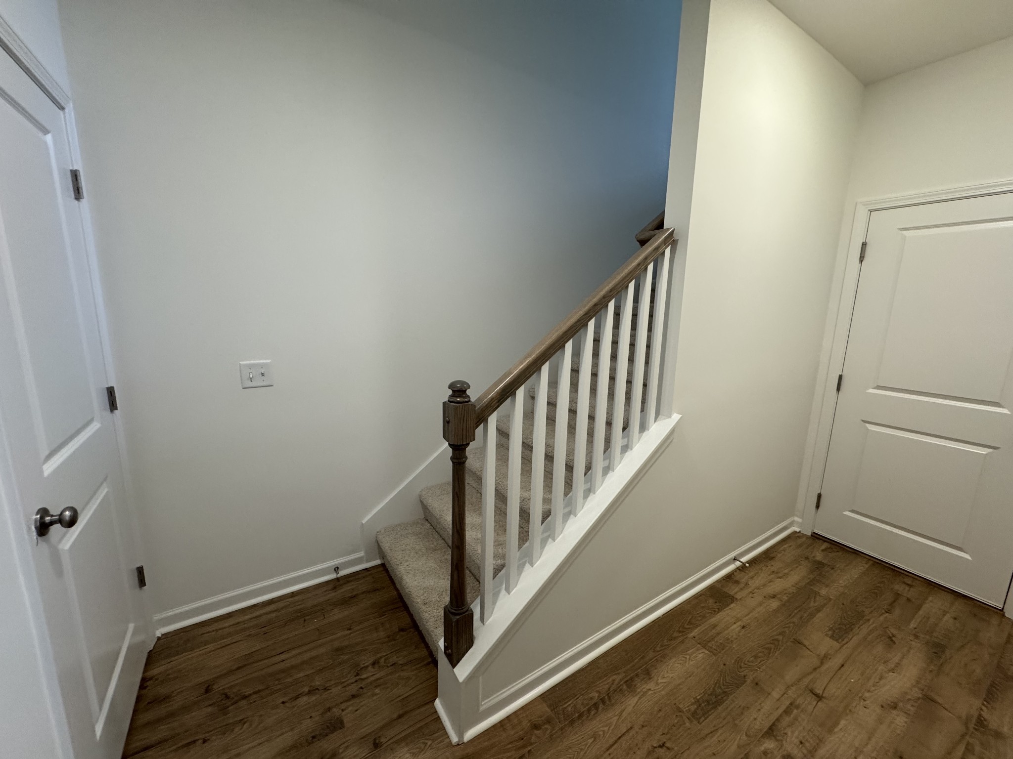410 Blair Road Smyrna, TN 37167 - Photo 15 of 27 a view of a hallway with wooden floor and staircase