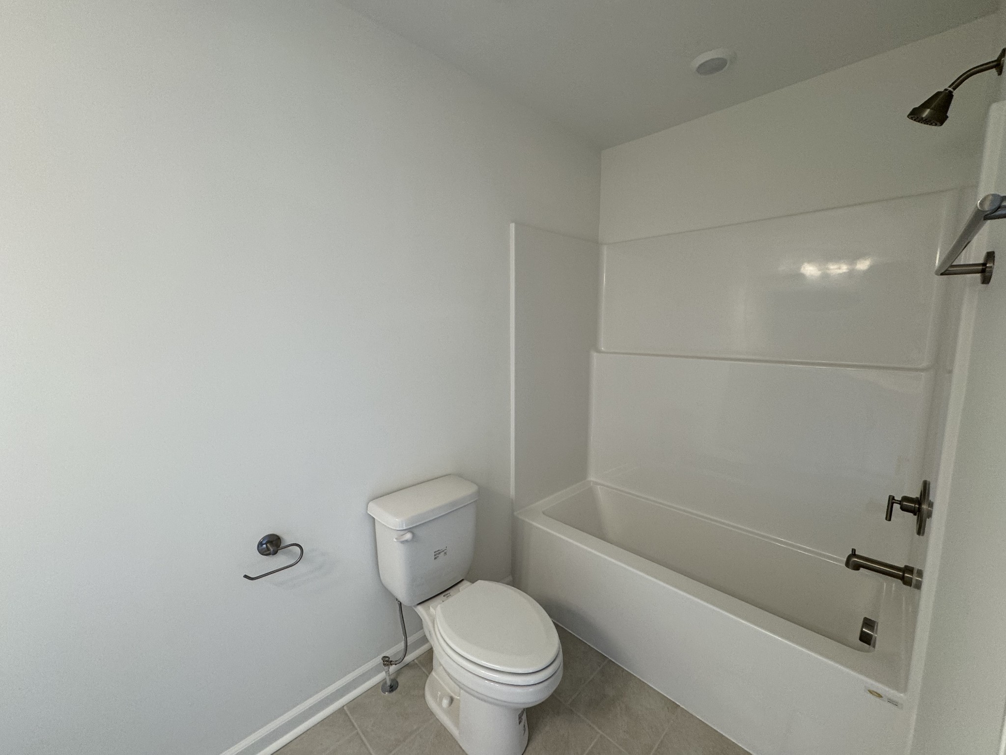 410 Blair Road Smyrna, TN 37167 - Photo 26 of 27 a white toilet sitting next to a bath tub and a shower