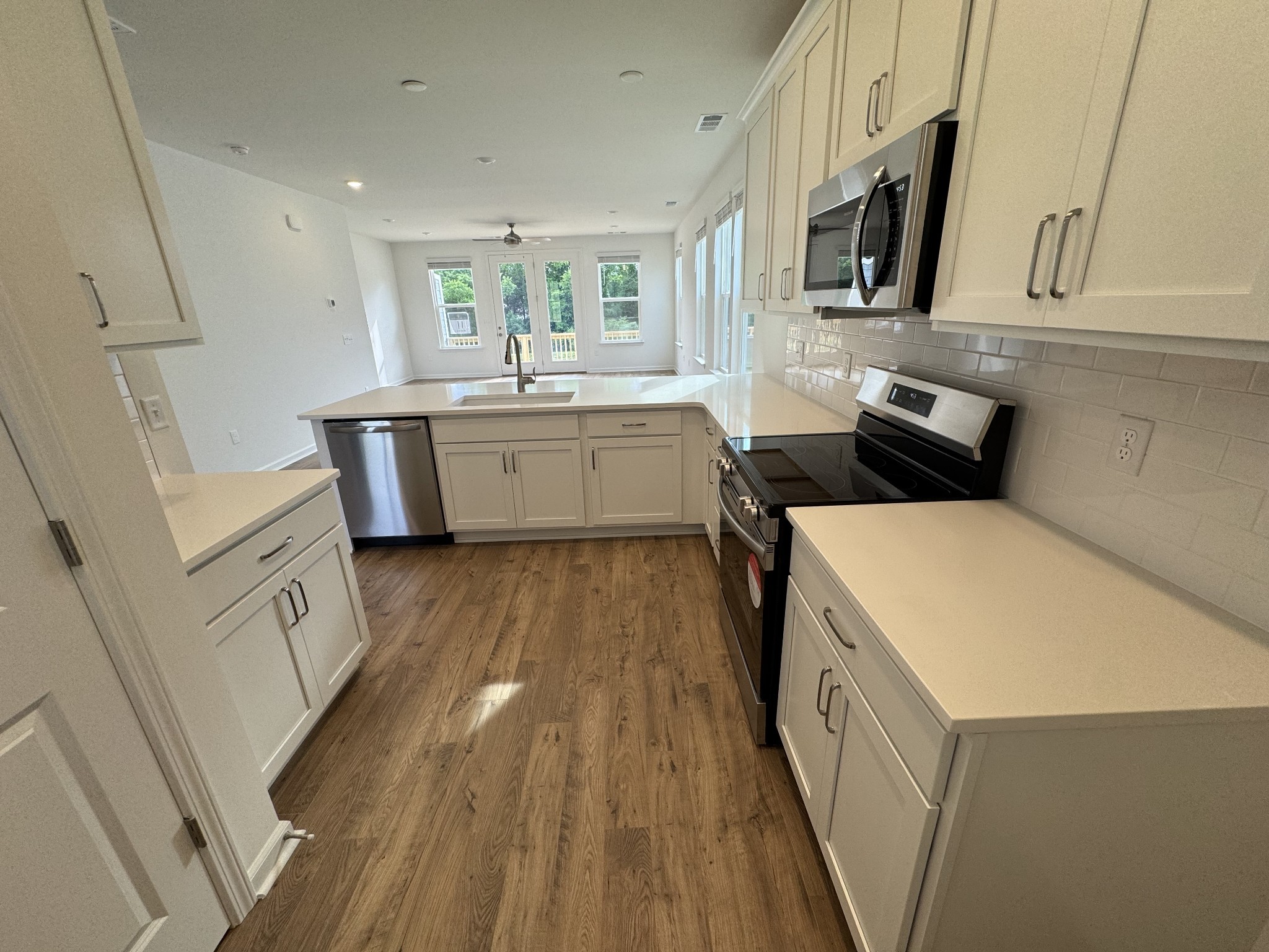 410 Blair Road Smyrna, TN 37167 - Photo 8 of 27 a kitchen with a sink a microwave a stove and refrigerator