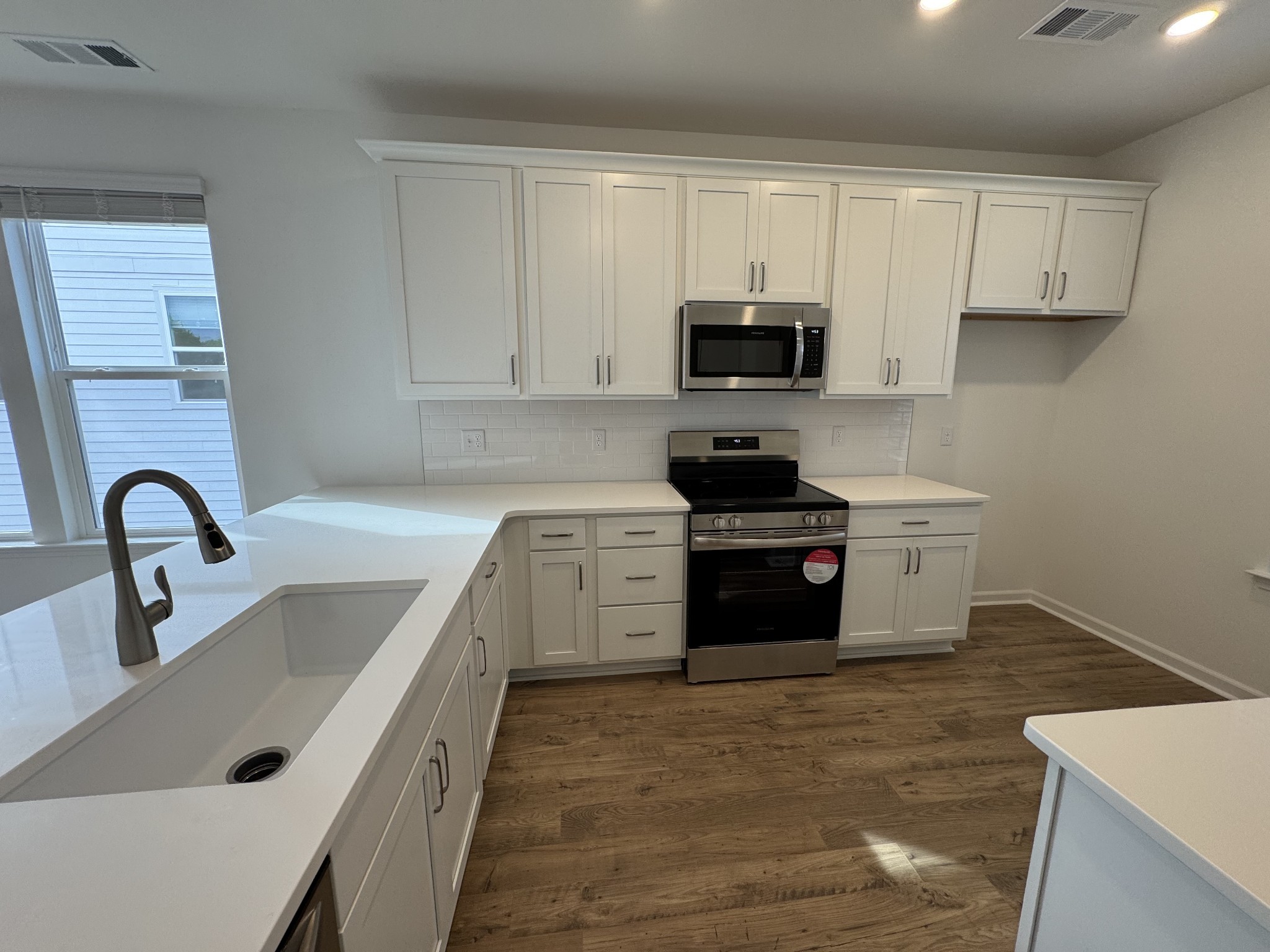 410 Blair Road Smyrna, TN 37167 - Photo 10 of 27 a kitchen with white cabinets and stainless steel appliances
