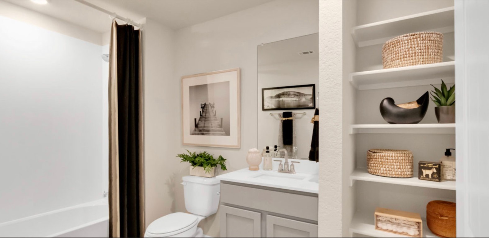 257 Frogmore Loop Kyle, TX 78640 - Photo 12 of 20 a bathroom with a toilet a sink and mirror