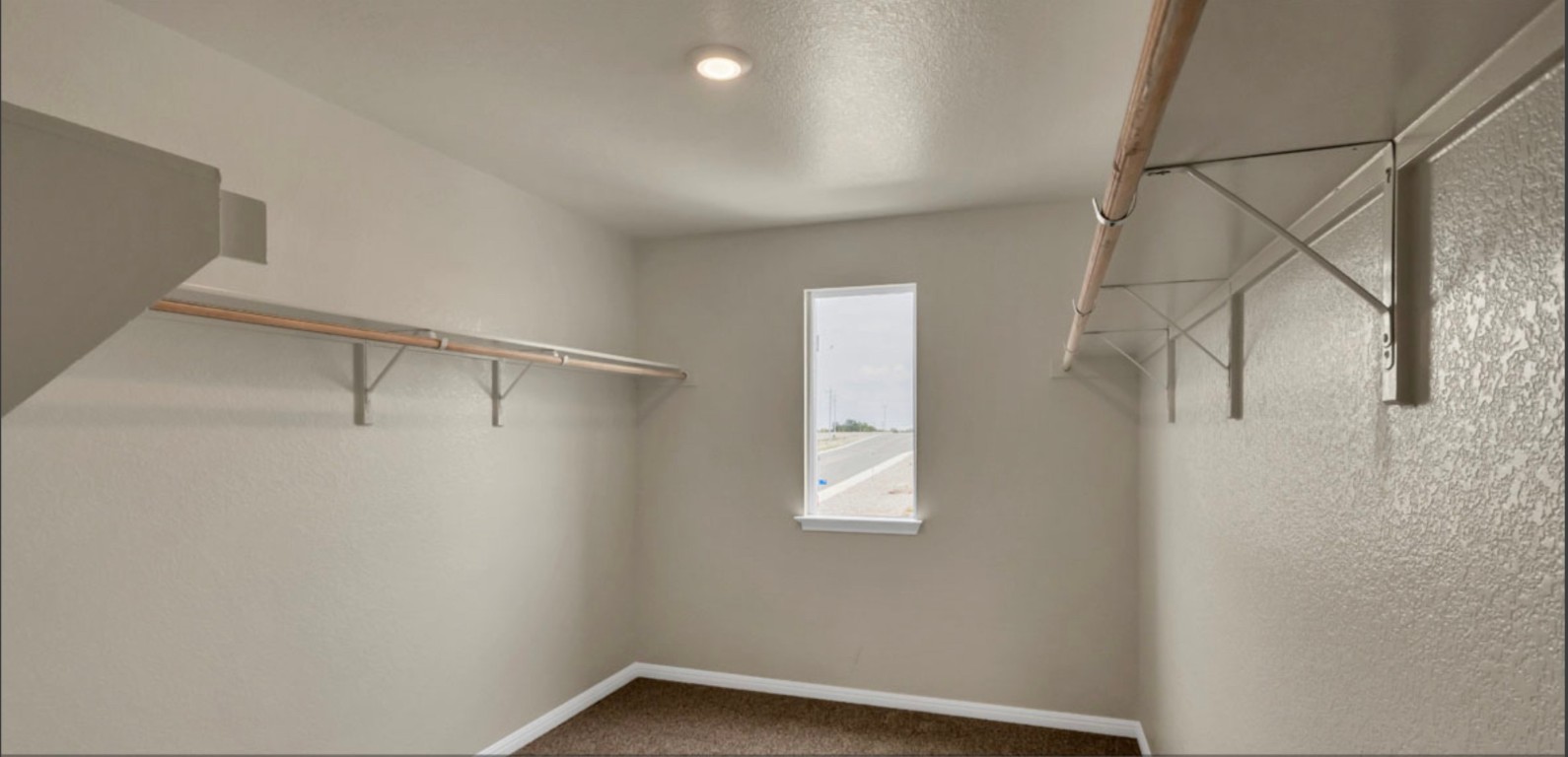 257 Frogmore Loop Kyle, TX 78640 - Photo 18 of 20 a view of small space with racks on the wall