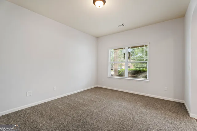 a kitchen with stainless steel appliances granite countertop wooden cabinets granite counter tops and a stove