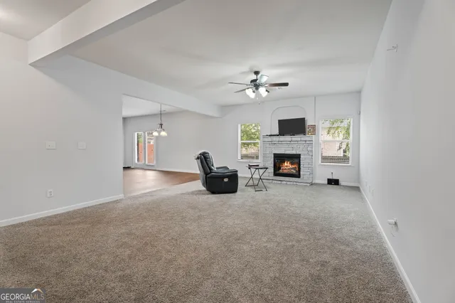 a kitchen with granite countertop stainless steel appliances and wooden cabinets