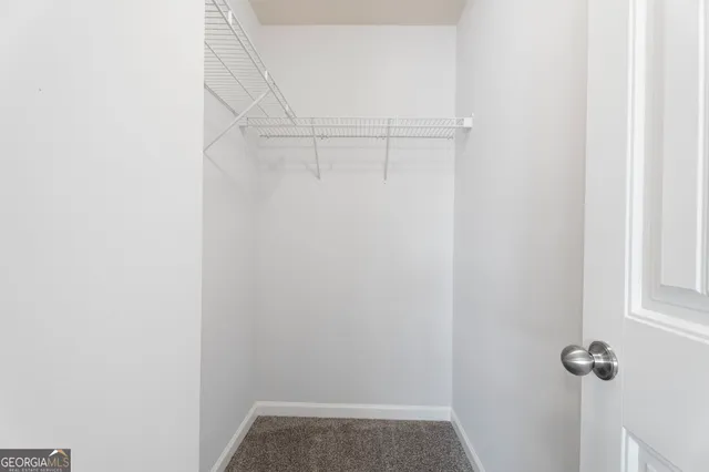 a view of a room with racks on the wall