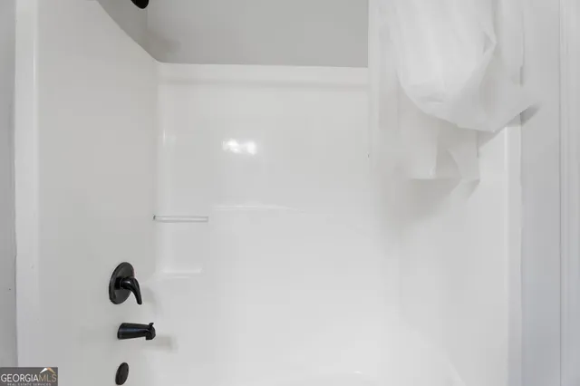 an aerial view of a house with a garden and trees