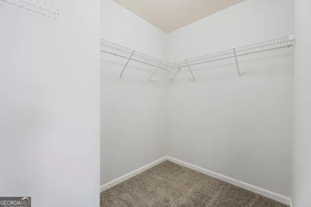 an aerial view of a house with yard swimming pool and outdoor seating