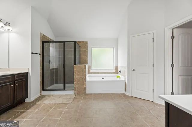 an aerial view of a house with swimming pool and porch