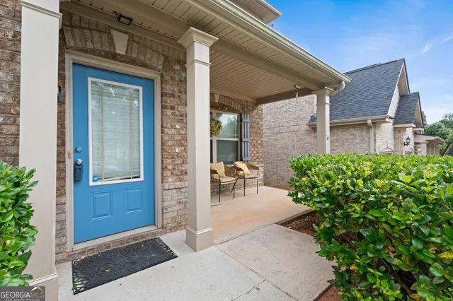 a view of hallway with wooden floor