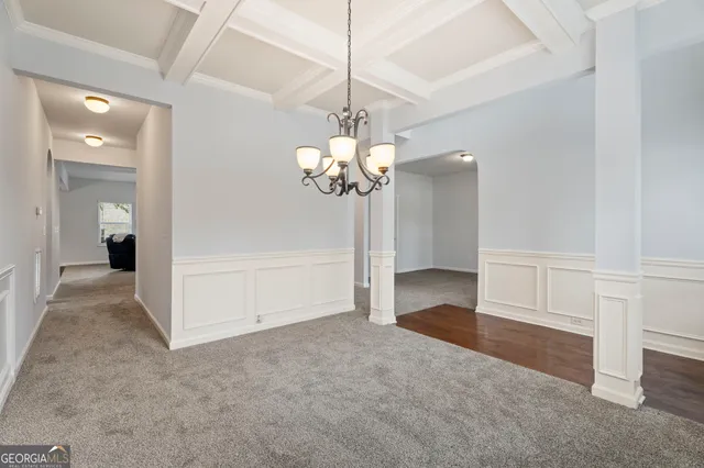 a view of a kitchen with a sink cabinets and wooden floor