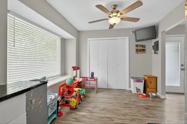 a bedroom with furniture and a window