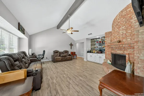 a living room with furniture fireplace and couch