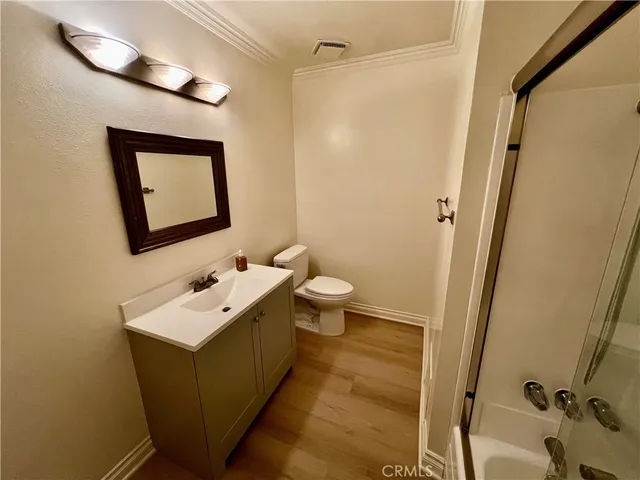 a bathroom with a tub and shower