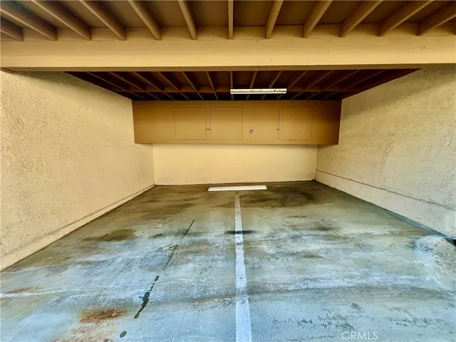 a view of a patio with table and chairs with wooden floor and fence