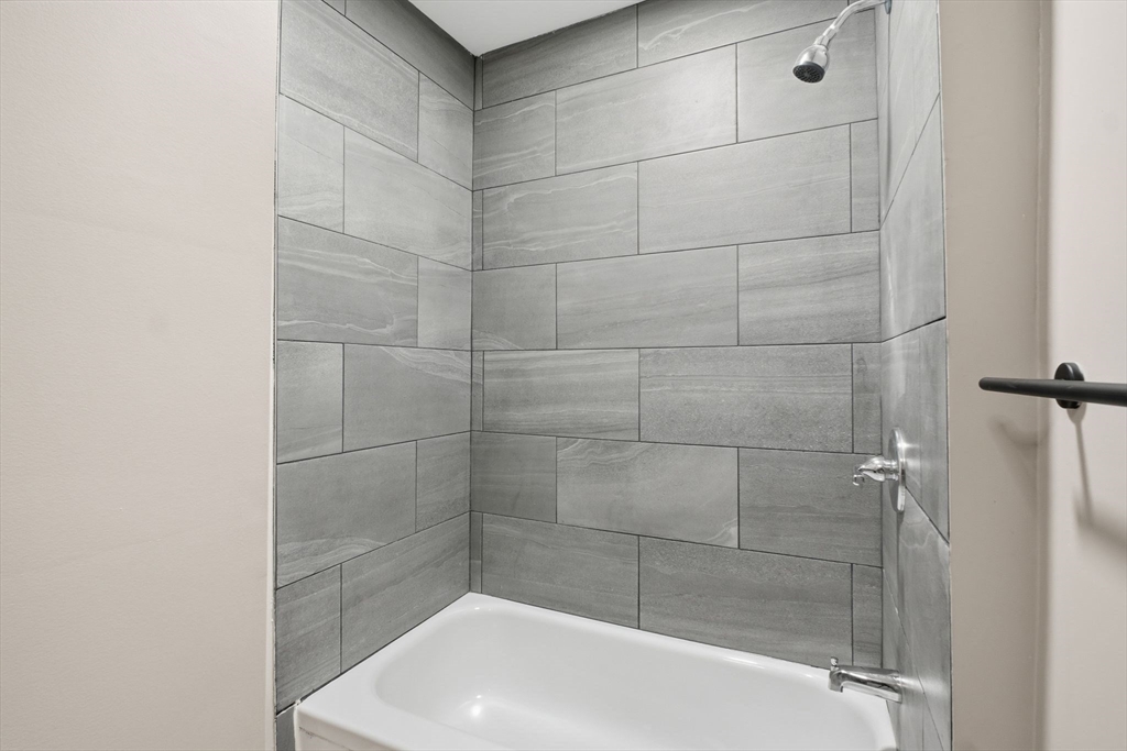 52 Osgood Street Springfield, MA 01107 - Photo 13 of 42 a bathroom with a bathtub