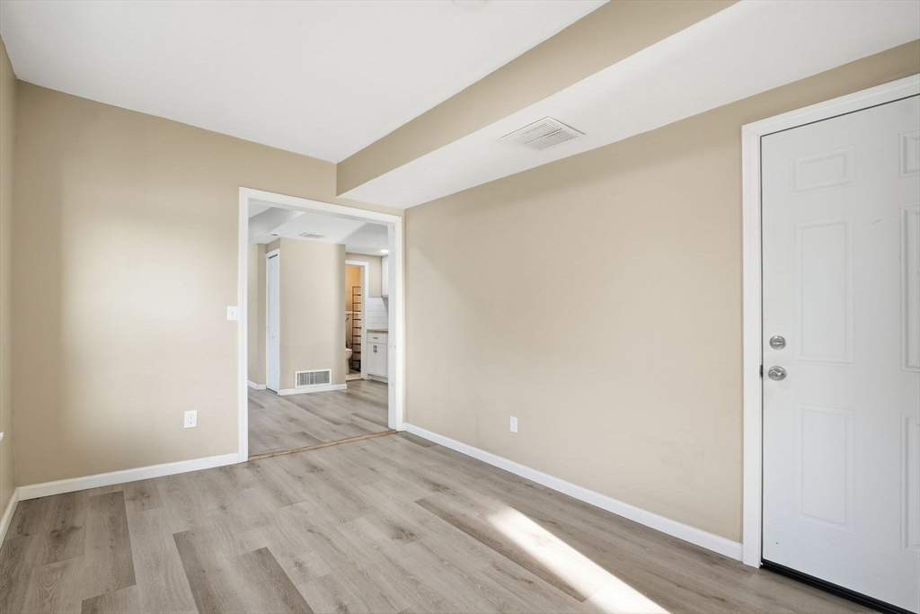 52 Osgood Street Springfield, MA 01107 - Photo 20 of 42 an empty room with wooden floor and closet