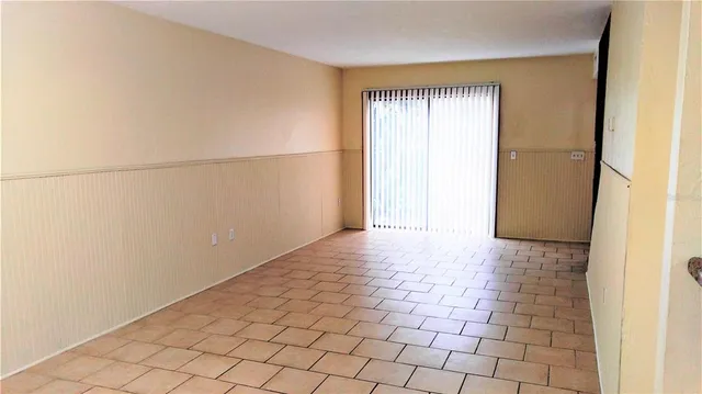 a view of an empty room and window