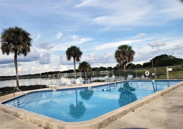 a view of a swimming pool with an ocean view
