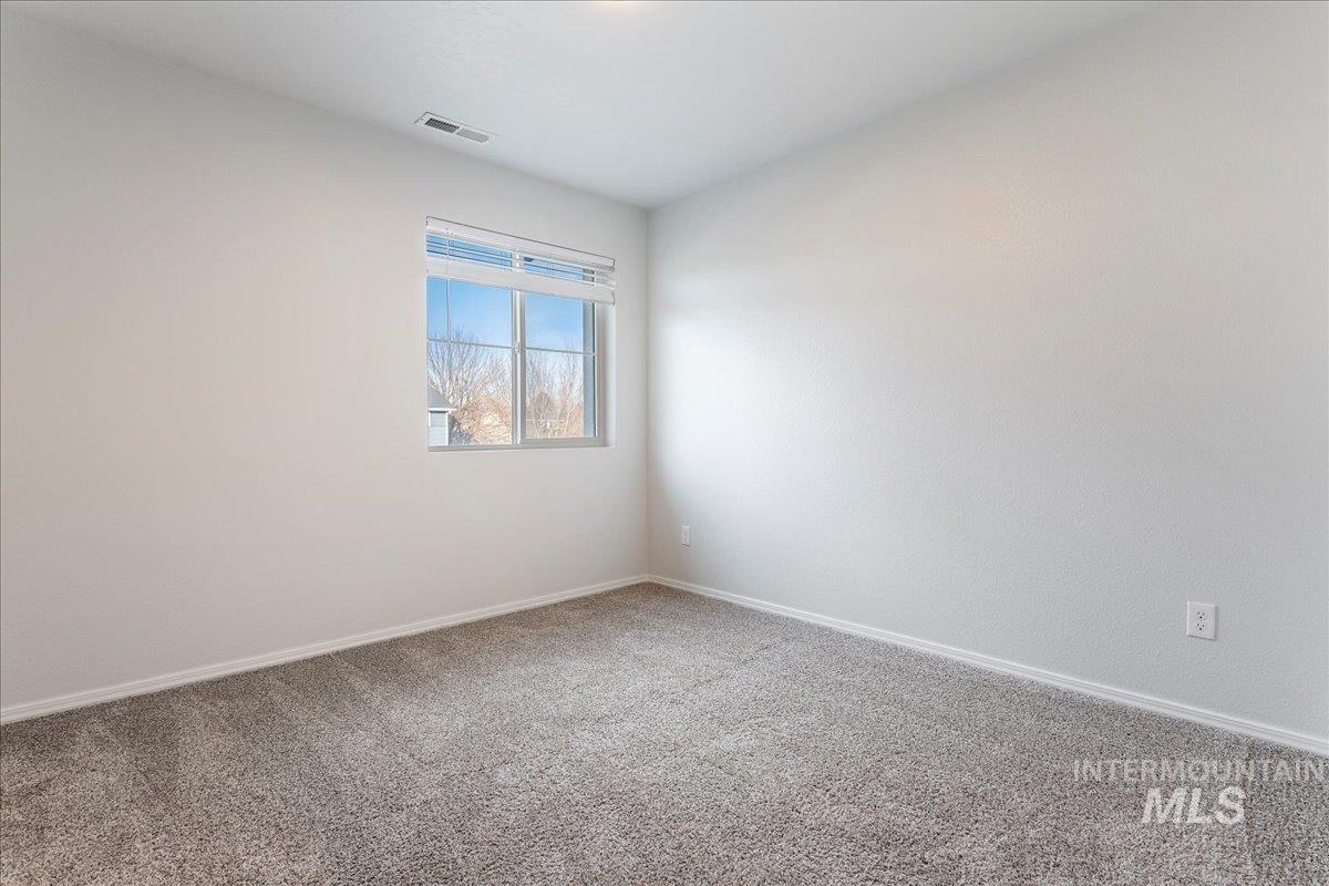 961 West Apple Pine Street Meridian, ID 83646 - Photo 17 of 30 Unfurnished room with carpet flooring and baseboards