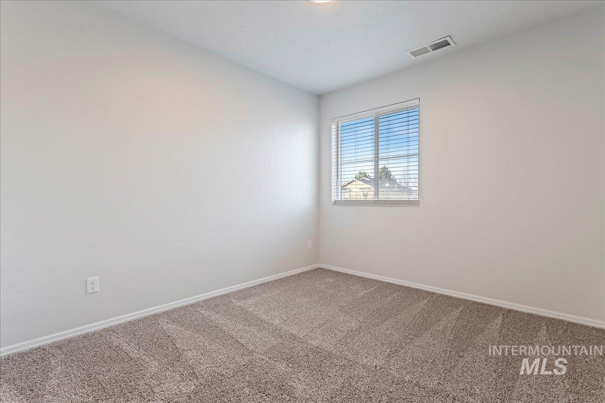 961 West Apple Pine Street Meridian, ID 83646 - Photo 19 of 30 Carpeted spare room featuring baseboards