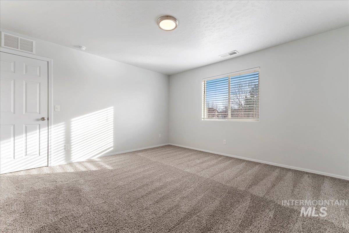 961 West Apple Pine Street Meridian, ID 83646 - Photo 21 of 30 Carpeted empty room featuring baseboards