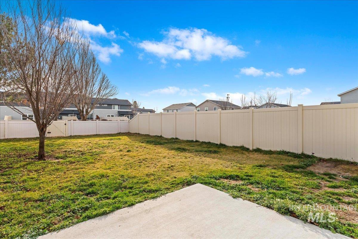961 West Apple Pine Street Meridian, ID 83646 - Photo 24 of 30 Fenced backyard featuring a residential view