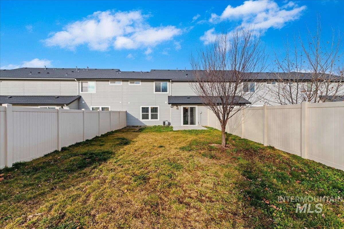 961 West Apple Pine Street Meridian, ID 83646 - Photo 26 of 30 Rear view of property with a fenced backyard and a patio area