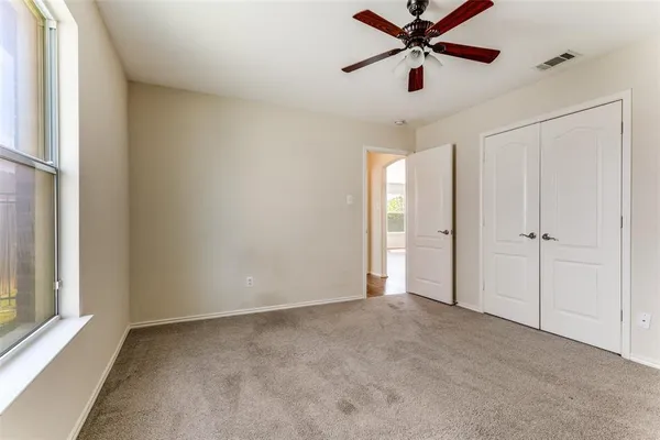 a view of a chandelier fan in a room