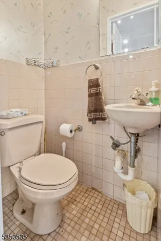 a bathroom with a toilet and a sink